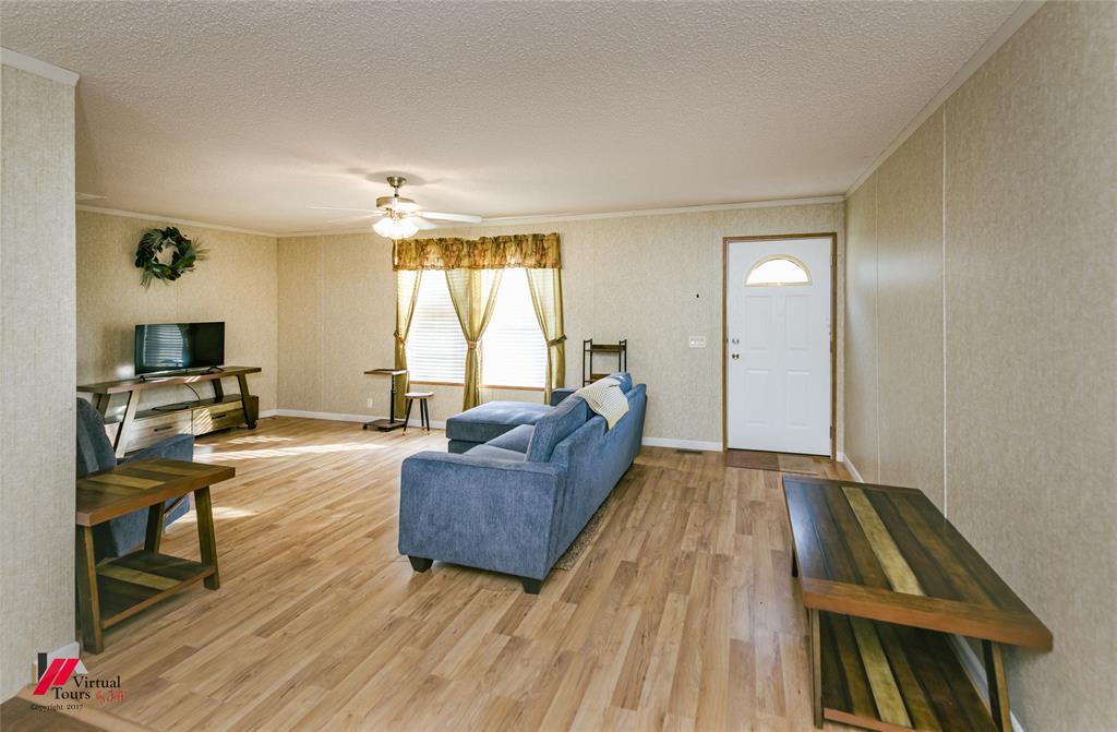 259 Kings Circle Grand Cane, LA 71032 - Photo 8 of 38 a living room with furniture and a wooden floor