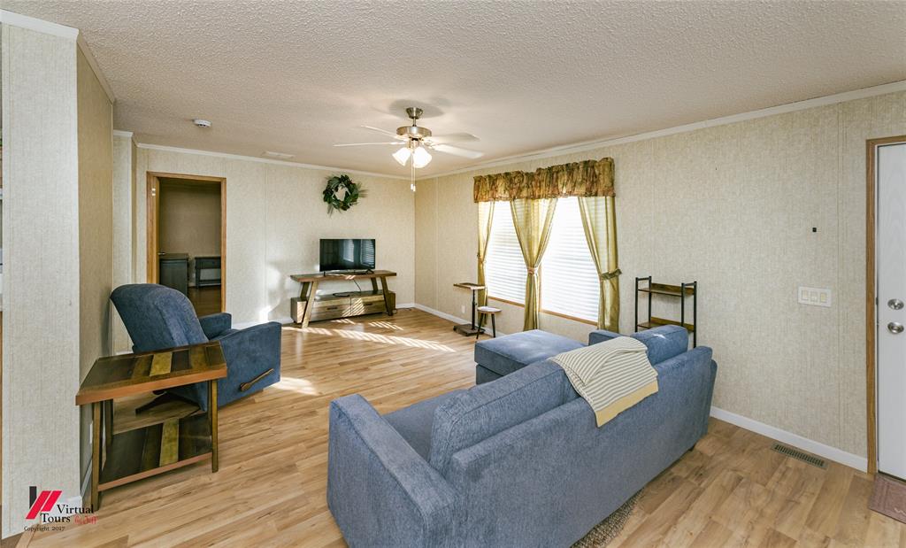 259 Kings Circle Grand Cane, LA 71032 - Photo 9 of 38 a living room with furniture fireplace and flat screen tv