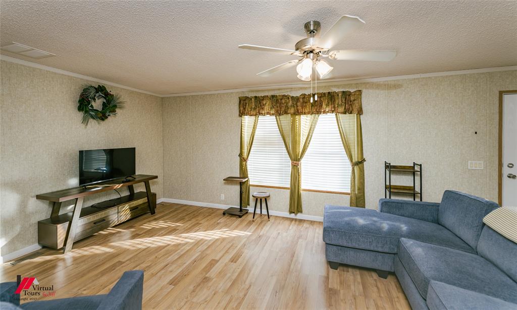 259 Kings Circle Grand Cane, LA 71032 - Photo 10 of 38 a living room with furniture and a flat screen tv