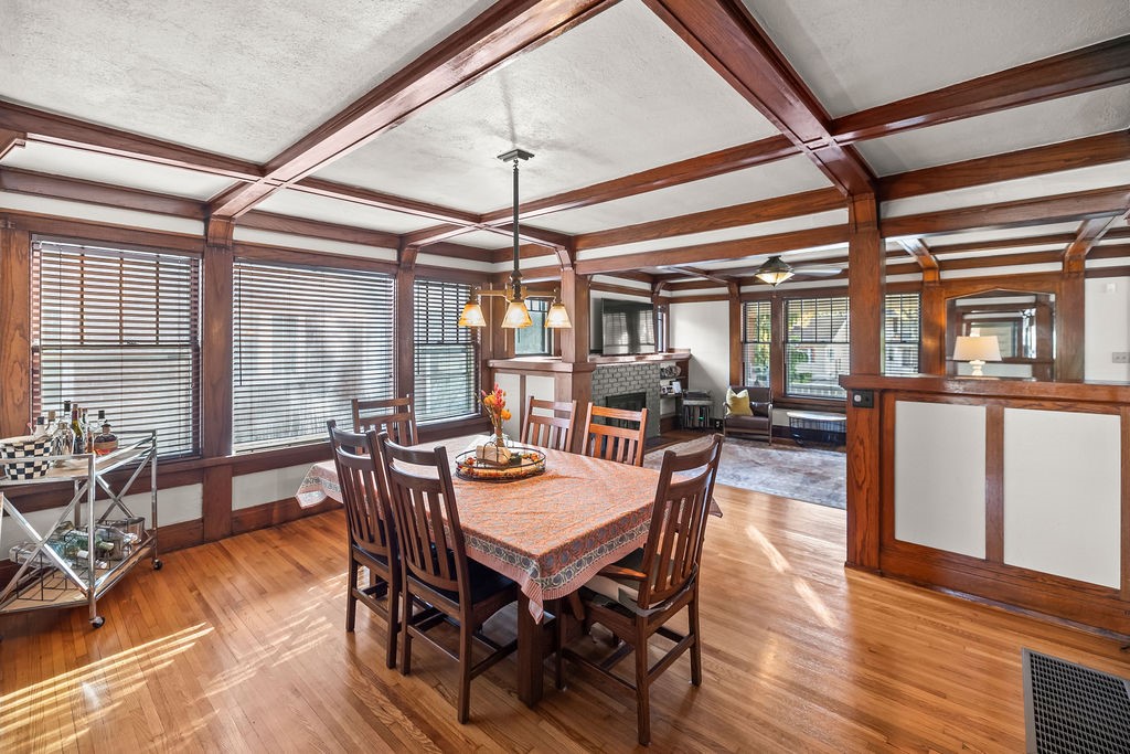 176 North Taylor Avenue Decatur, IL 62522 - Photo 12 of 45 a dining room with wooden floor a chandelier a wooden table and chairs