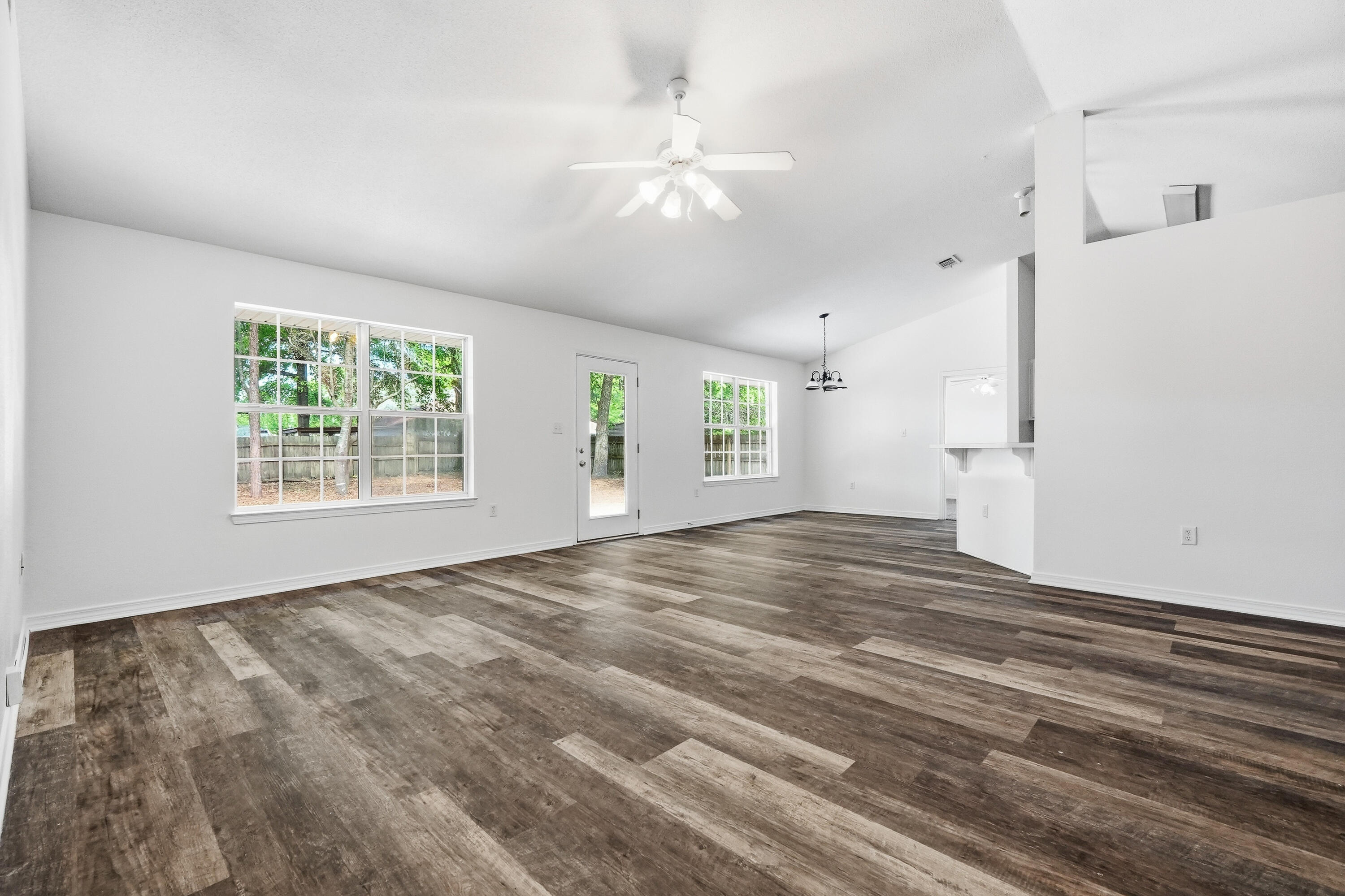 4087 Audiss Road Milton, FL 32583 - Photo 9 of 34 wooden floor in an empty room with a window