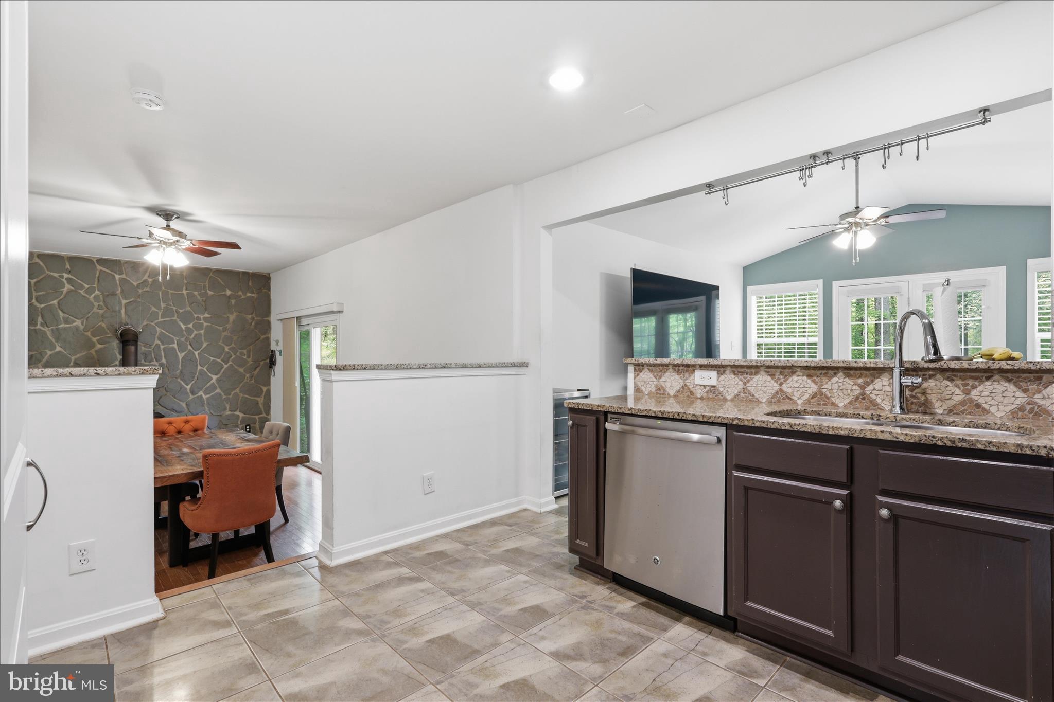 515 Shelton Shop Road Stafford, VA 22554 - Photo 14 of 52 a kitchen with stainless steel appliances granite countertop a sink and cabinets