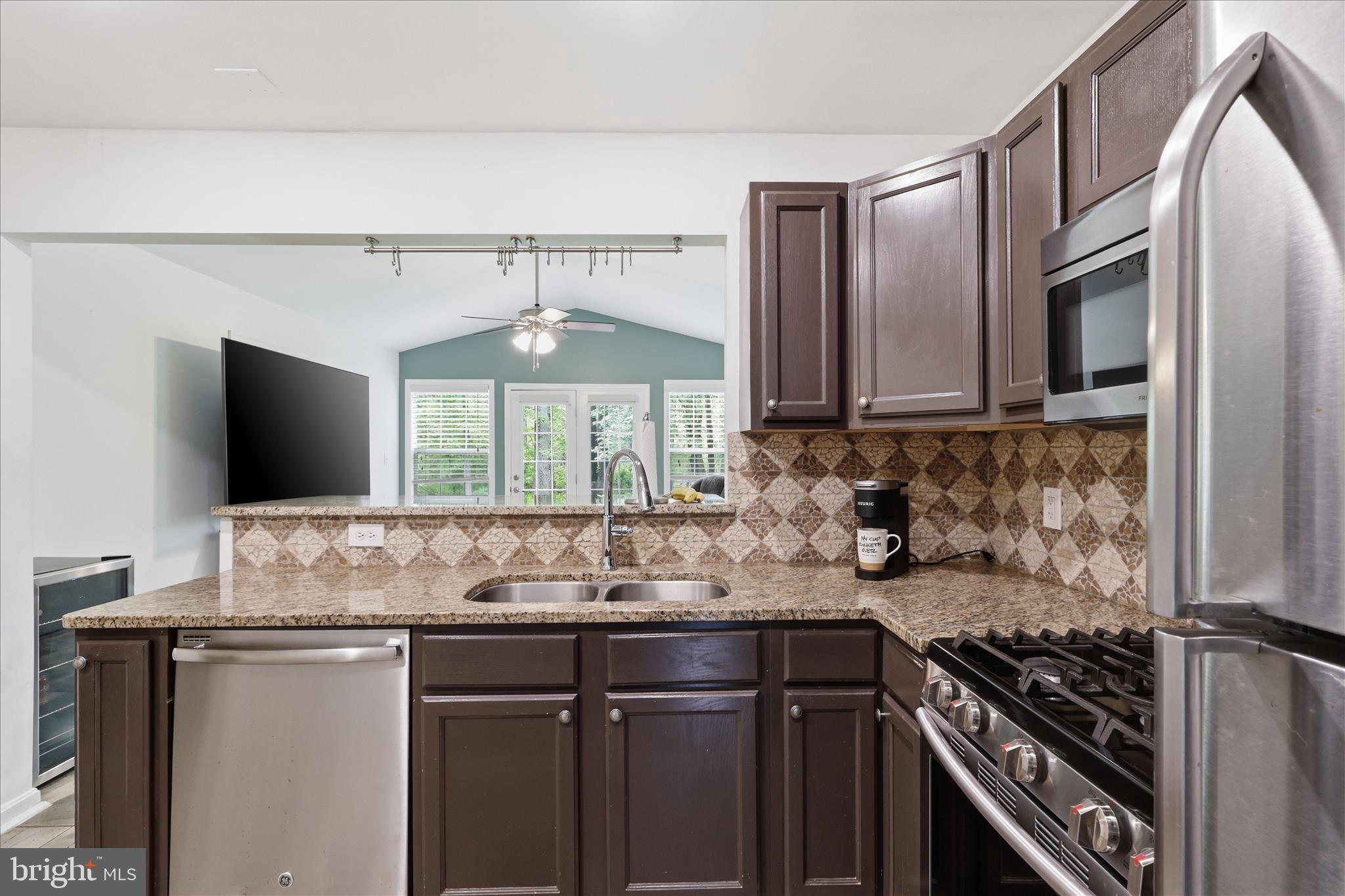 515 Shelton Shop Road Stafford, VA 22554 - Photo 16 of 52 a kitchen with a sink and a stove top oven