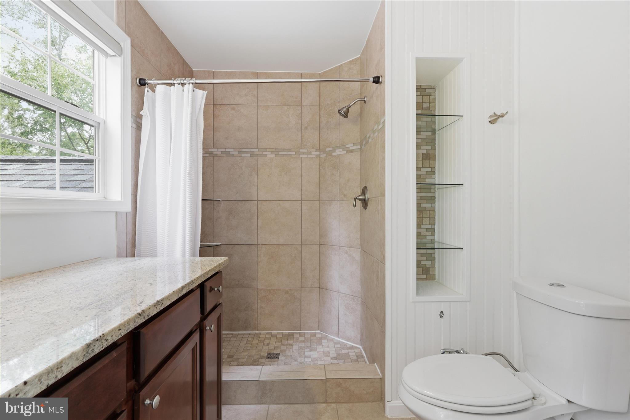 515 Shelton Shop Road Stafford, VA 22554 - Photo 29 of 52 a bathroom with a granite countertop bathtub shower sink vanity and toilet