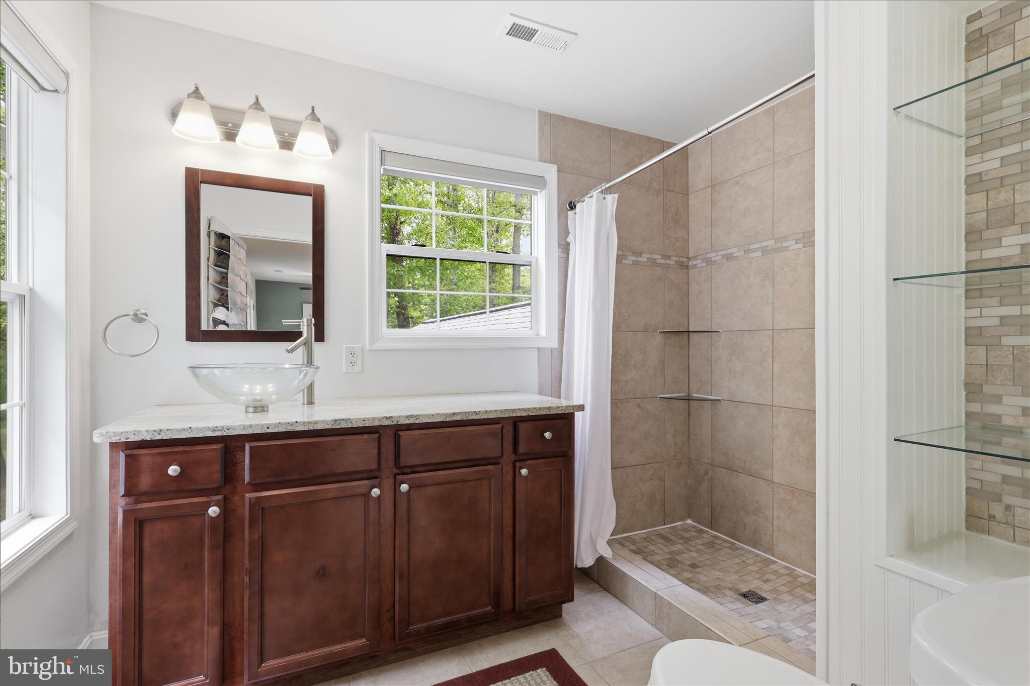 515 Shelton Shop Road Stafford, VA 22554 - Photo 30 of 52 a bathroom with a sink and a mirror