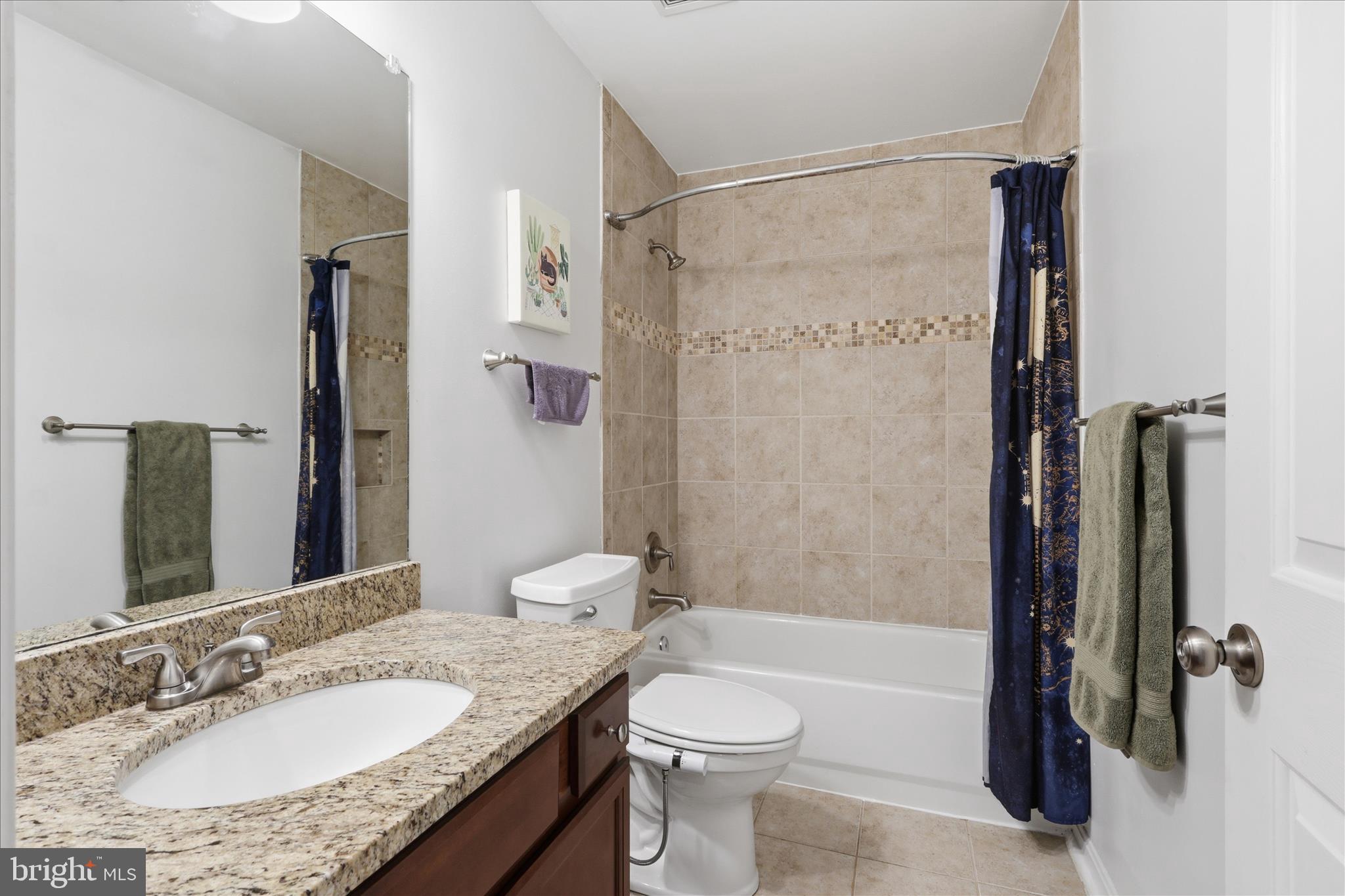515 Shelton Shop Road Stafford, VA 22554 - Photo 36 of 52 a bathroom with a granite countertop sink toilet and shower
