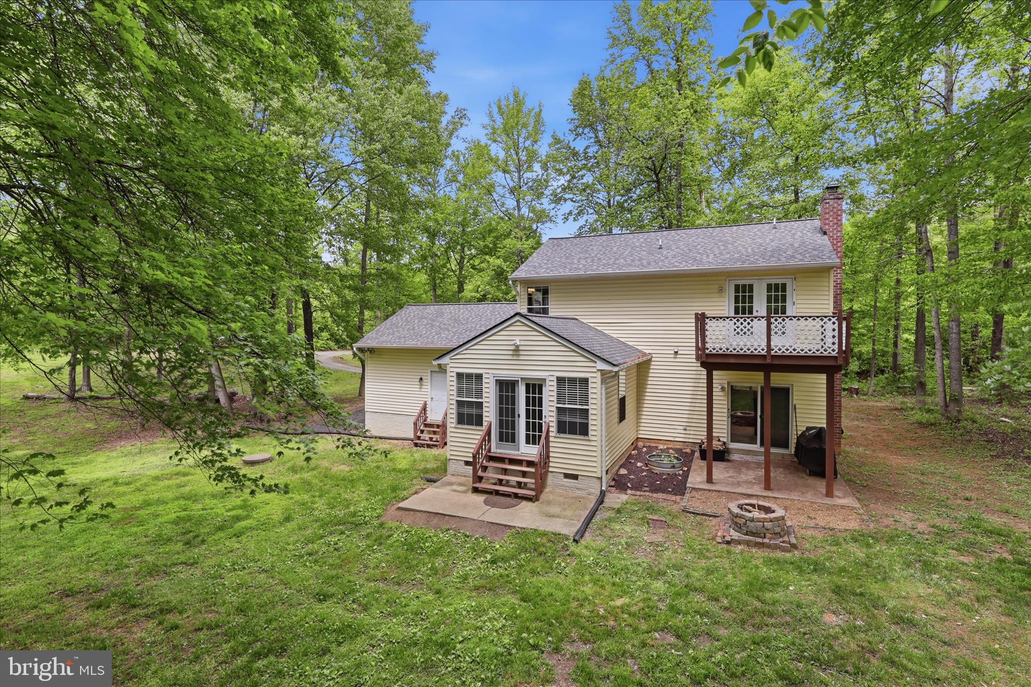 515 Shelton Shop Road Stafford, VA 22554 - Photo 41 of 52 a front view of a house with a garden and trees