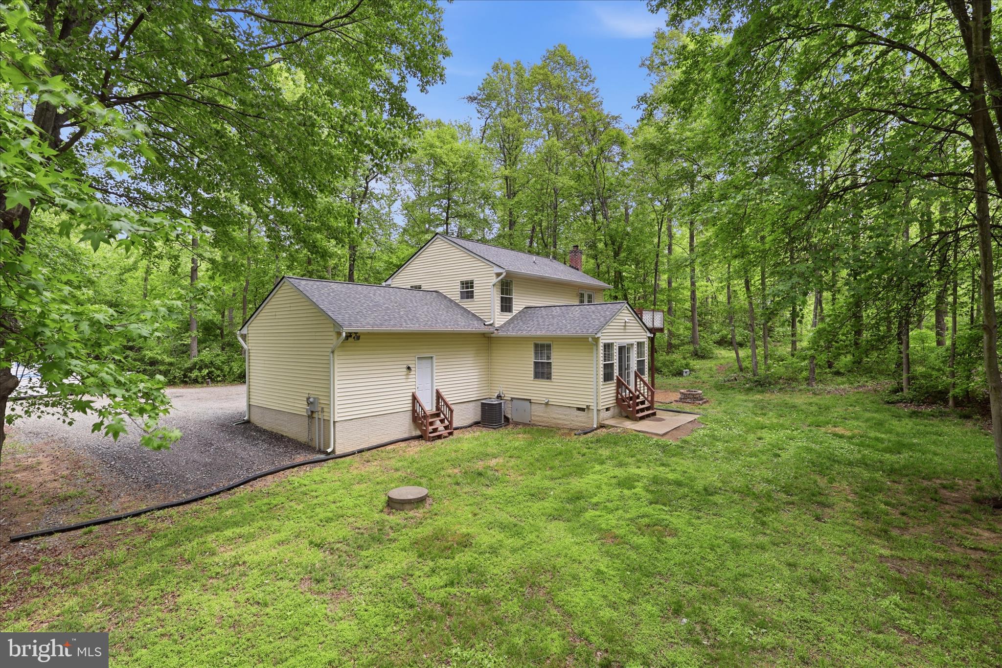 515 Shelton Shop Road Stafford, VA 22554 - Photo 43 of 52 a front view of a house with a garden and trees