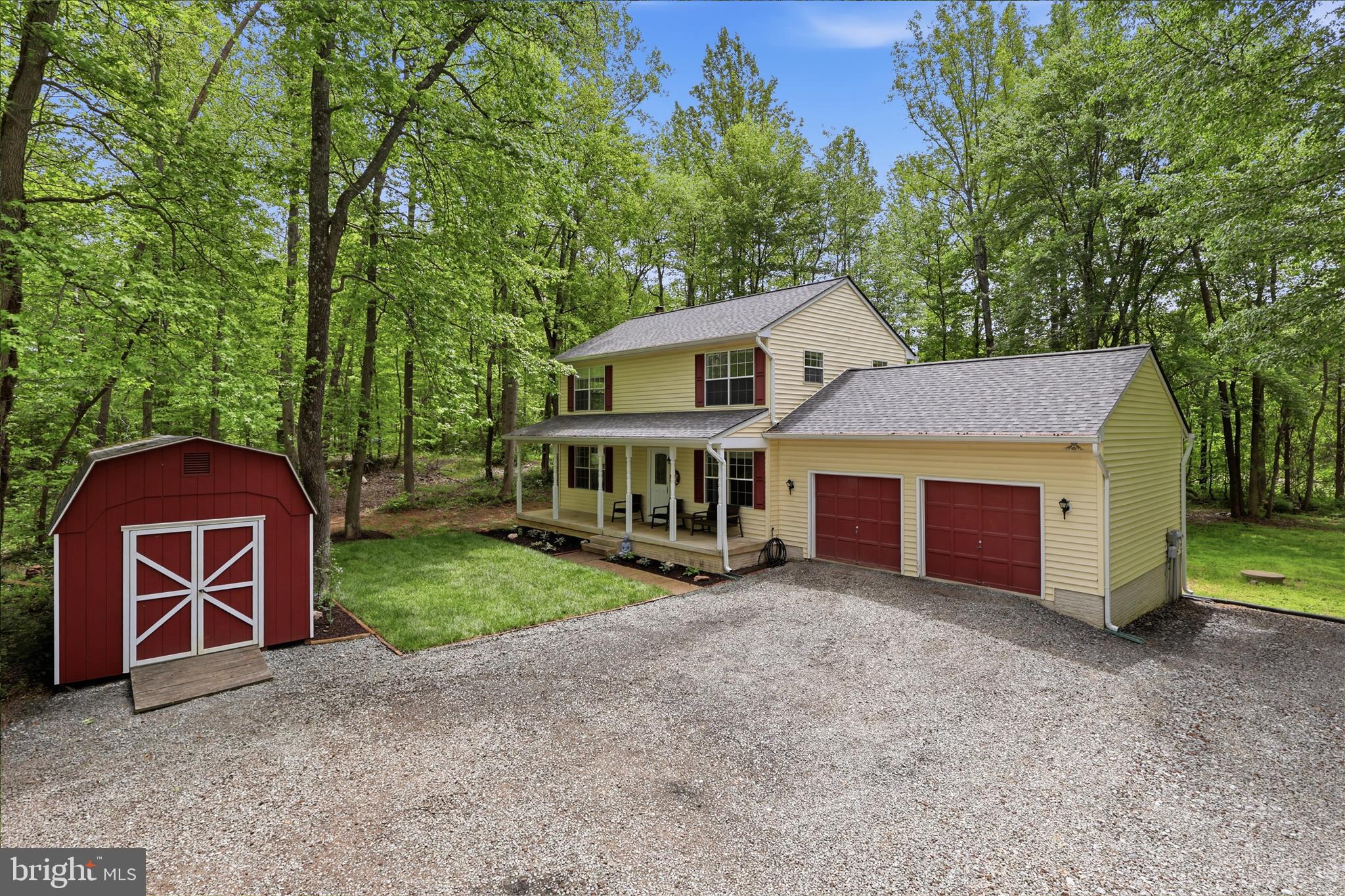 515 Shelton Shop Road Stafford, VA 22554 - Photo 6 of 52 a view of a house with a yard and large tree