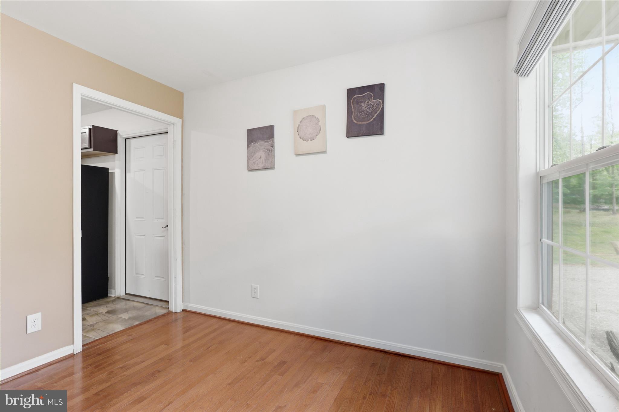 515 Shelton Shop Road Stafford, VA 22554 - Photo 9 of 52 an empty room with wooden floor and windows