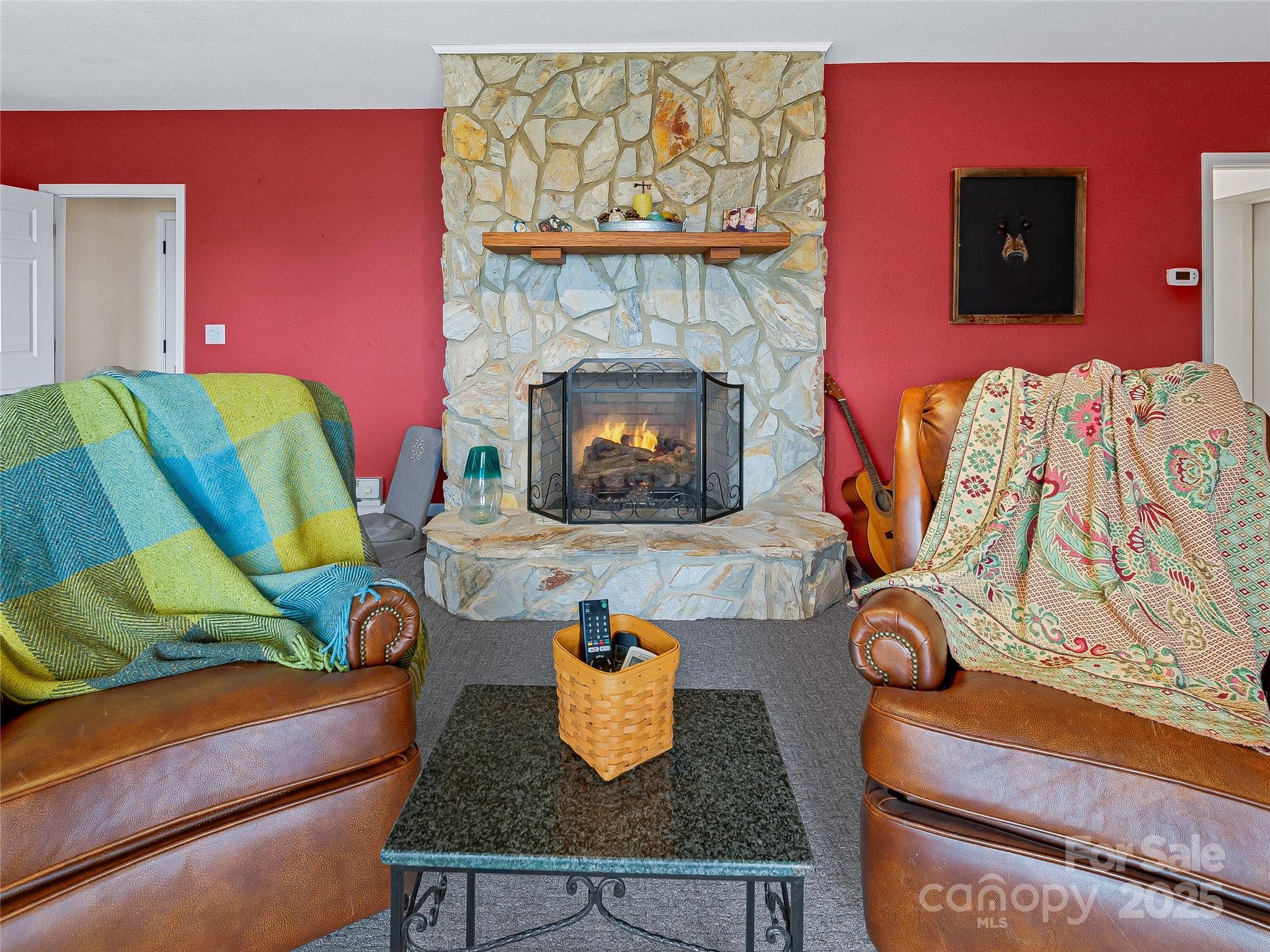21 Brandywine Road Waynesville, NC 28786 - Photo 32 of 48 a living room with furniture and a fireplace