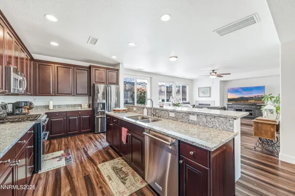 a kitchen that has a table and chairs in it