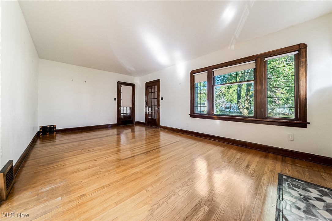 6711 Forest Avenue Parma, OH 44129 - Photo 6 of 33 Spare room featuring baseboards and light wood-style floors