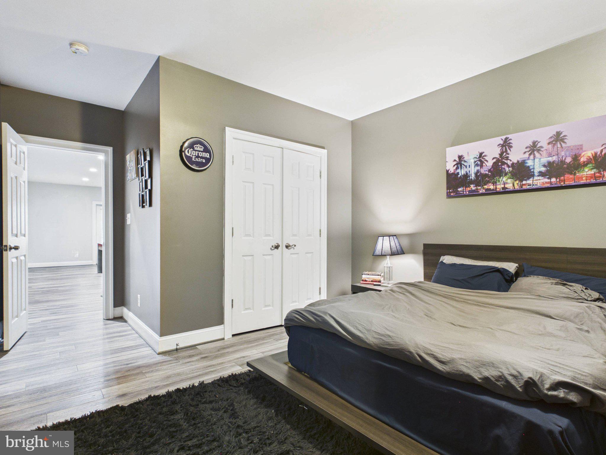 38565 Piggott Bottom Road Hamilton, VA 20158 - Photo 59 of 85 a bedroom with a bed and a painting on the wall