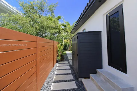 a view of a door and wooden floor
