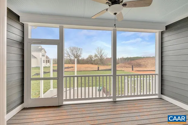 a bathroom with a granite countertop toilet a sink and a mirror