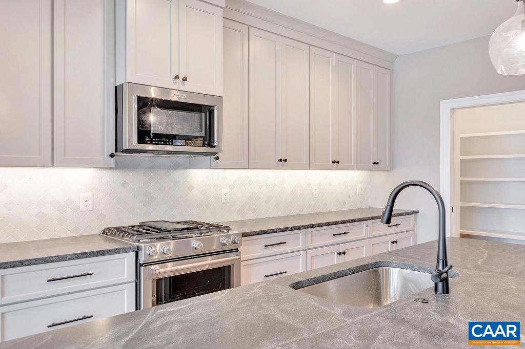 3 B Lonicera Way Charlottesville, VA 22911 - Photo 3 of 22 a kitchen with granite countertop a stove and a sink