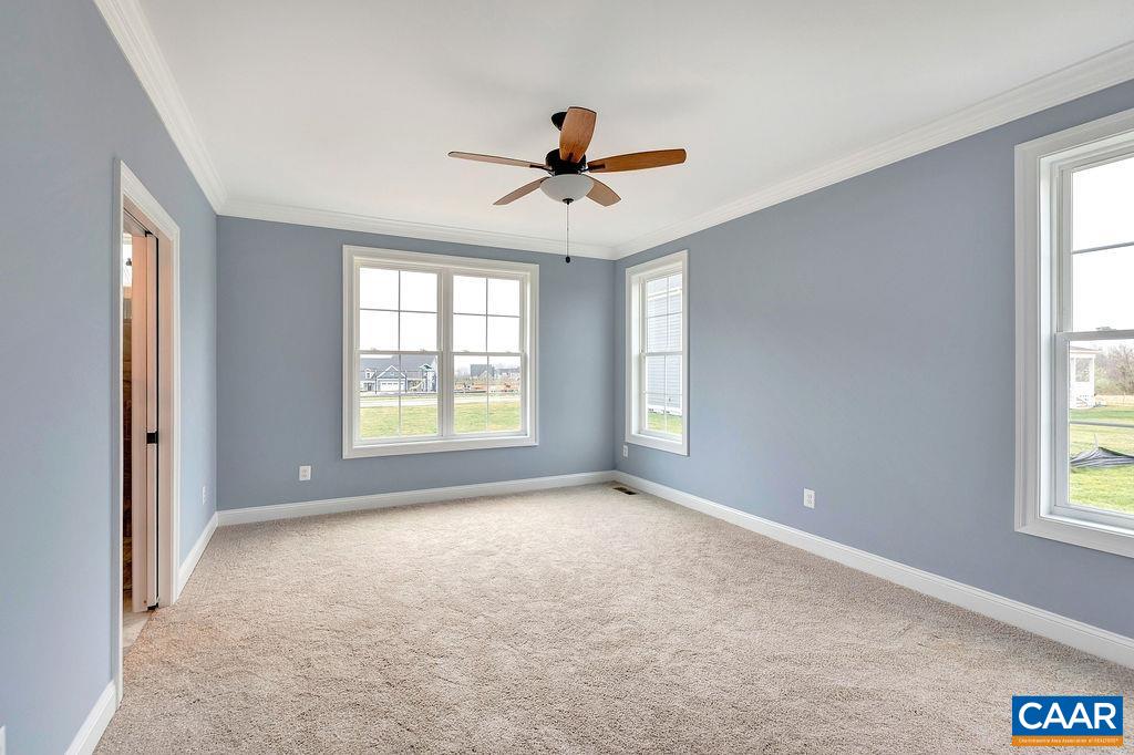 3 B Lonicera Way Charlottesville, VA 22911 - Photo 7 of 22 a view of a livingroom with a window and a ceiling fan