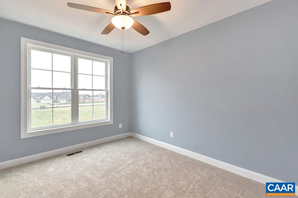 3 B Lonicera Way Charlottesville, VA 22911 - Photo 8 of 22 an empty room with a window and a fan