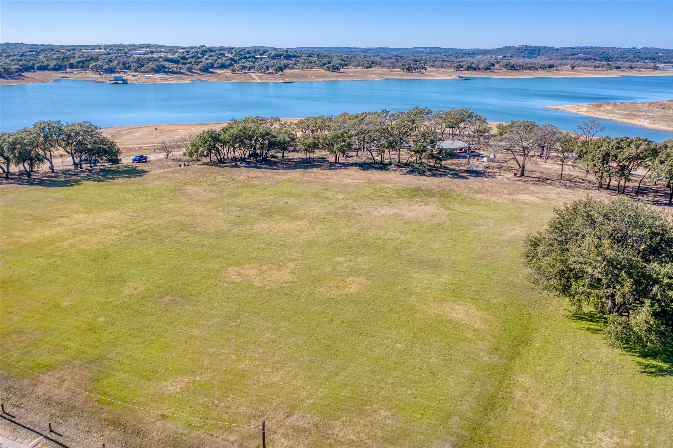 20702 N Ridge Lago Vista, TX 78645 - Photo 15 of 16 a view of a lake with houses in the back