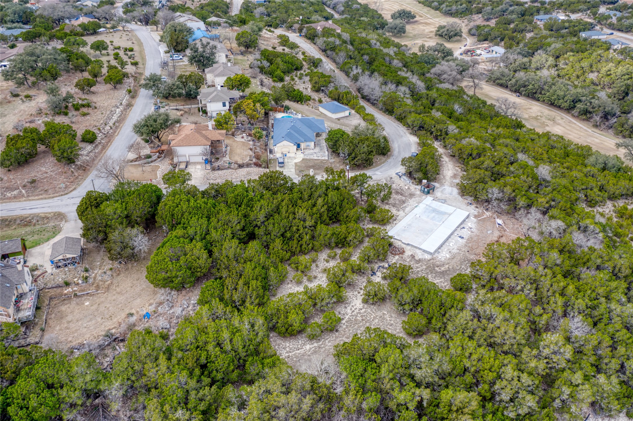 20702 N Ridge Lago Vista, TX 78645 - Photo 2 of 16 an aerial view of residential house with outdoor space and trees all around