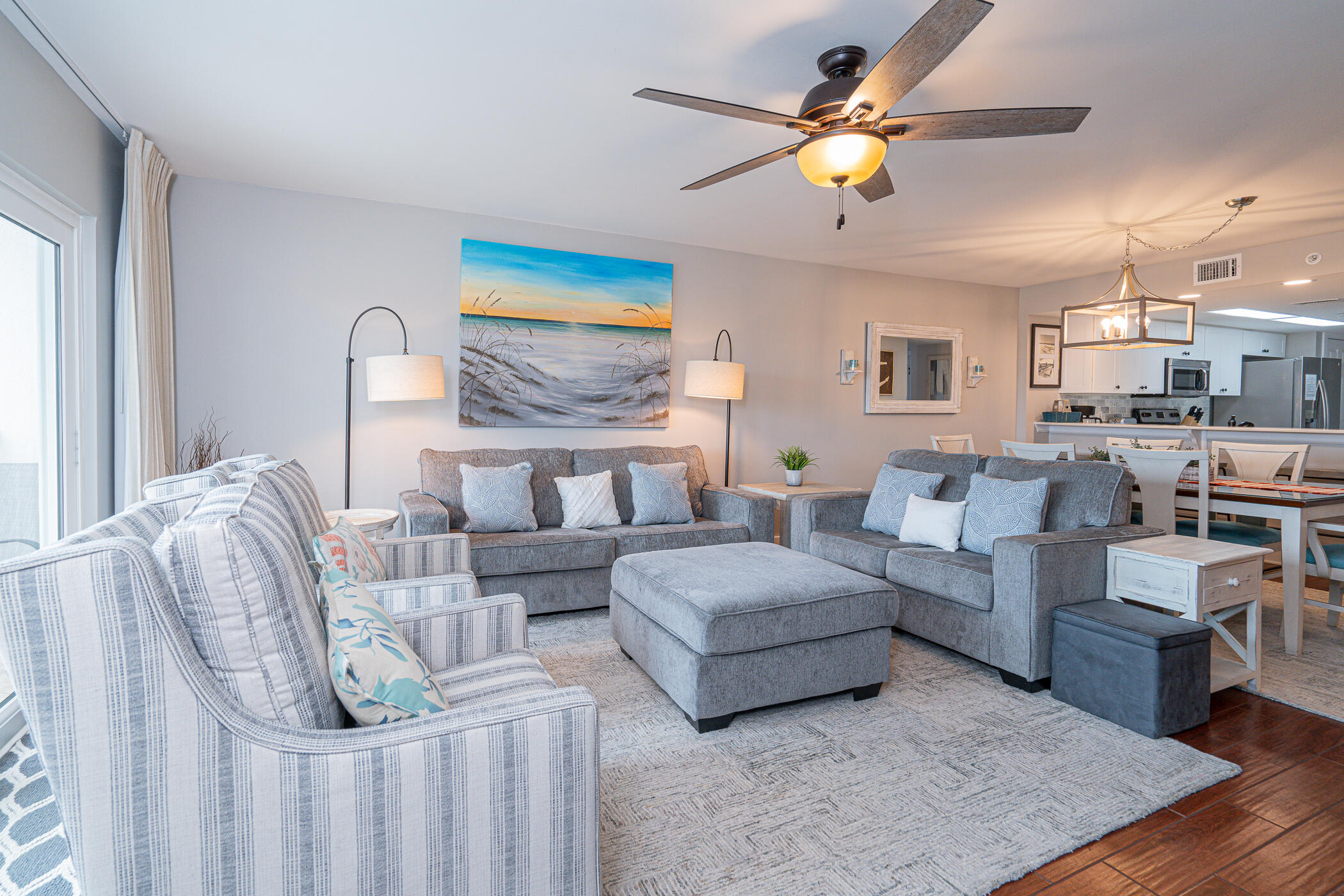 895 Santa Rosa Boulevard, Unit 308 Fort Walton Beach, FL 32548 - Photo 12 of 31 a living room with furniture and a chandelier