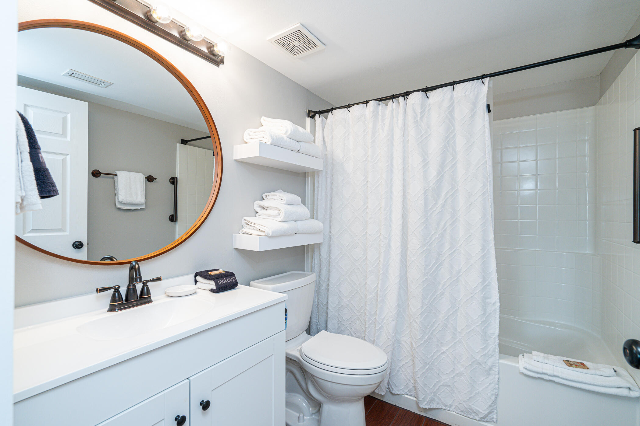 895 Santa Rosa Boulevard, Unit 308 Fort Walton Beach, FL 32548 - Photo 14 of 31 a bathroom with a sink toilet and mirror