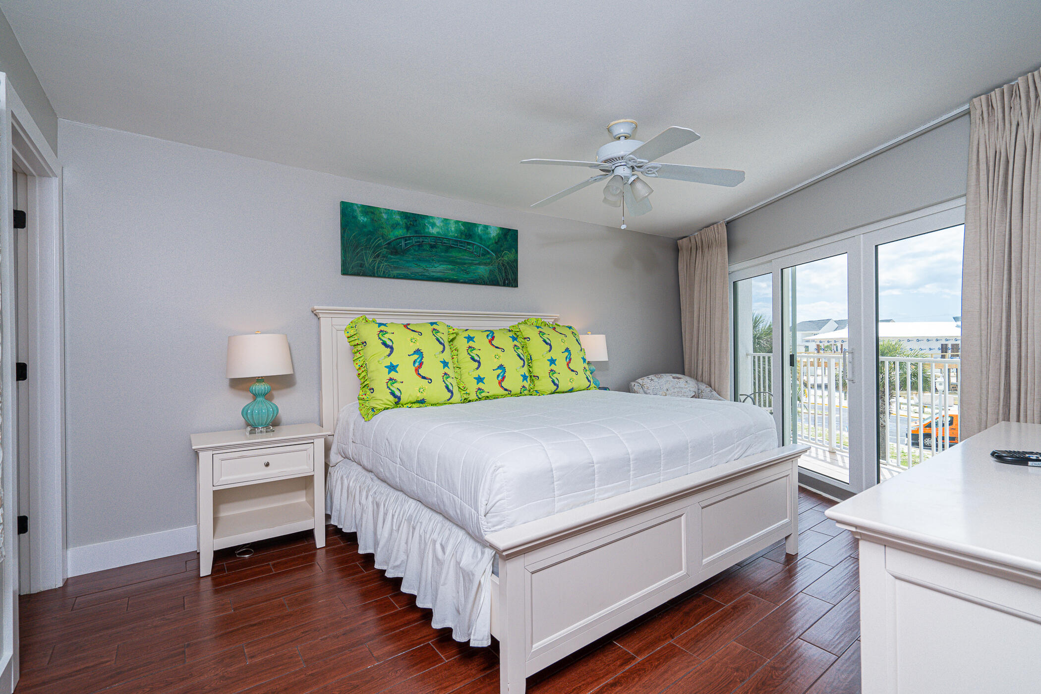 895 Santa Rosa Boulevard, Unit 308 Fort Walton Beach, FL 32548 - Photo 18 of 31 a bedroom with a large bed and a chandelier