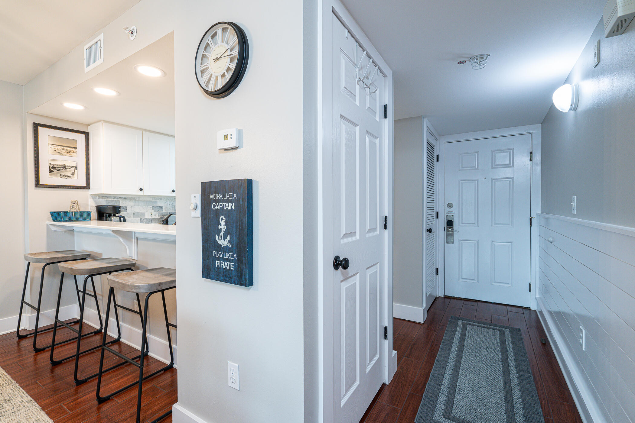 895 Santa Rosa Boulevard, Unit 308 Fort Walton Beach, FL 32548 - Photo 2 of 31 a view of kitchen with furniture and wooden floor