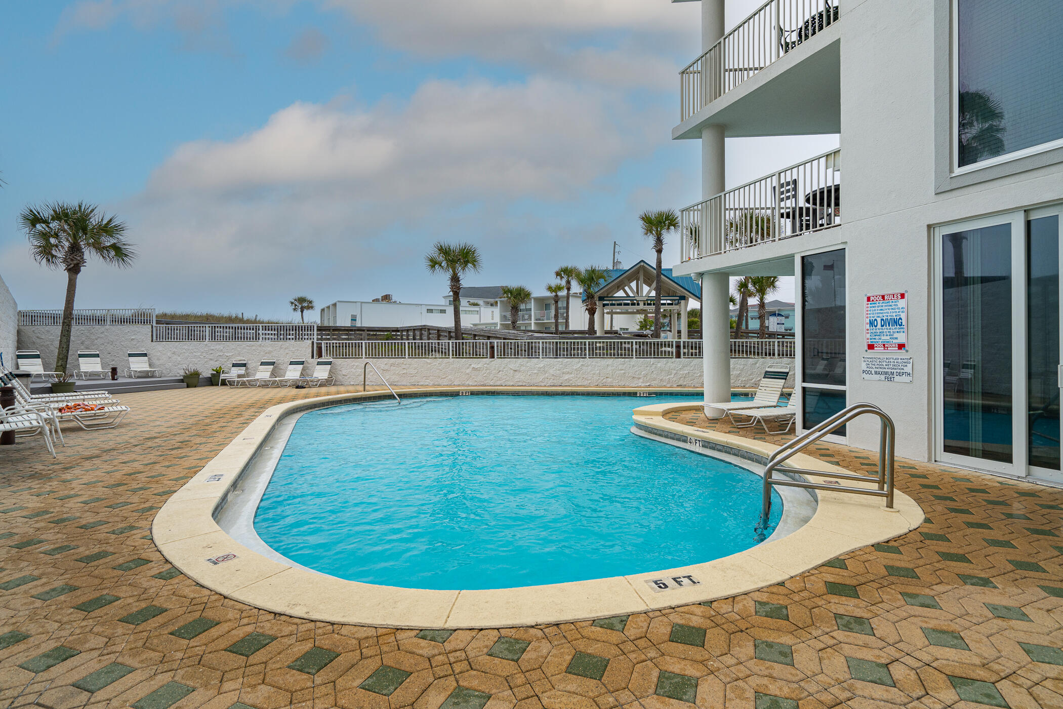 895 Santa Rosa Boulevard, Unit 308 Fort Walton Beach, FL 32548 - Photo 28 of 31 a view of a swimming pool with outdoor seating