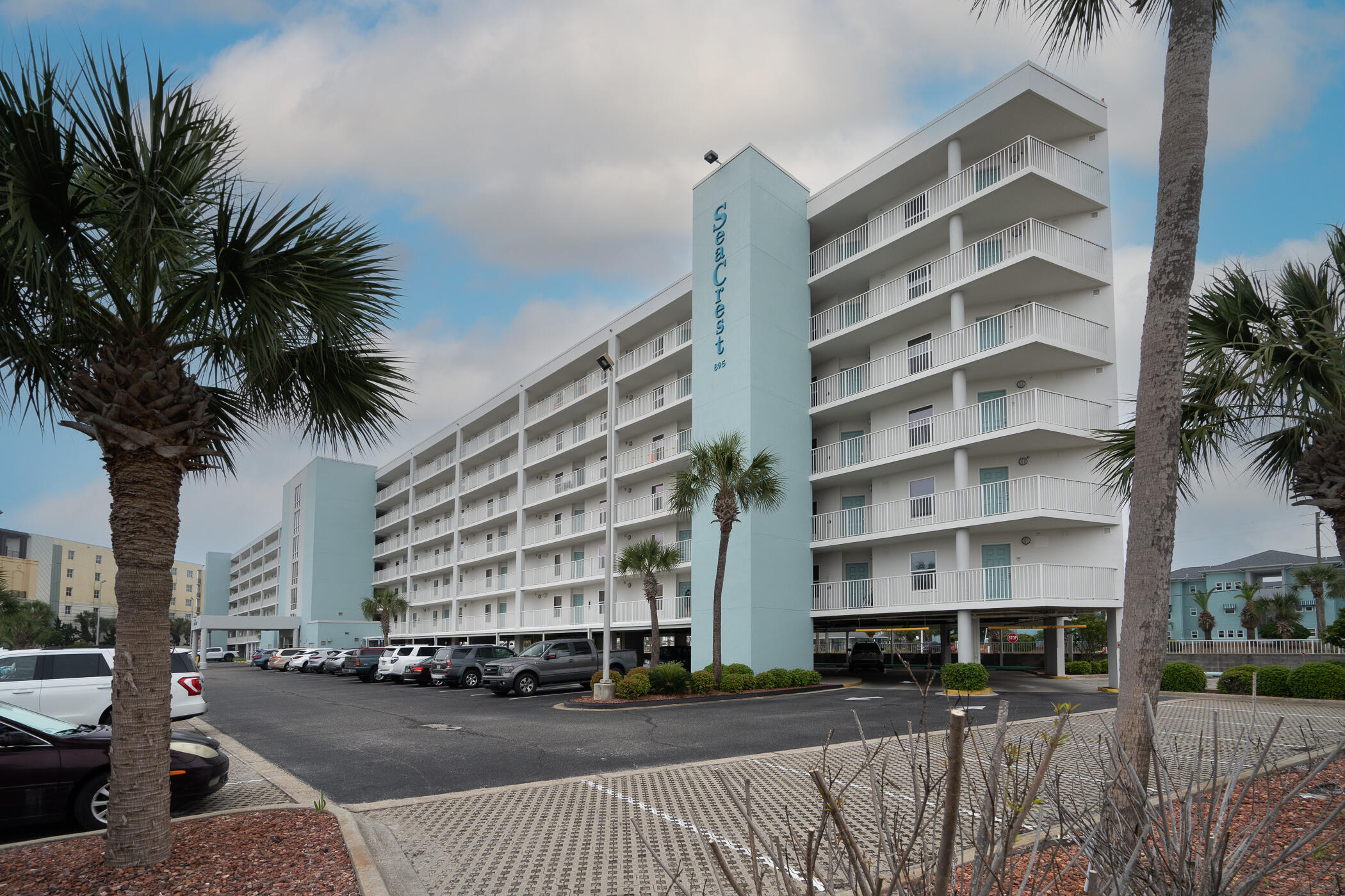 895 Santa Rosa Boulevard, Unit 308 Fort Walton Beach, FL 32548 - Photo 29 of 31 a front view of a building with streets and trees
