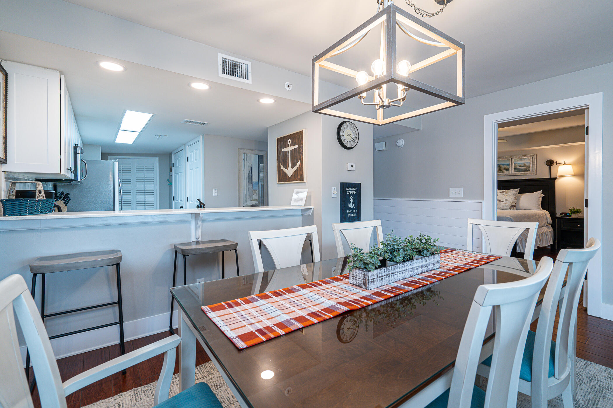 895 Santa Rosa Boulevard, Unit 308 Fort Walton Beach, FL 32548 - Photo 8 of 31 a view of a dining room with furniture and a chandelier