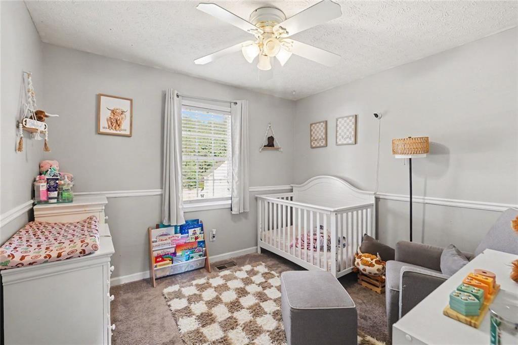 302 Fairview Lane Dallas, GA 30157 - Photo 15 of 26 a bedroom with furniture and a window