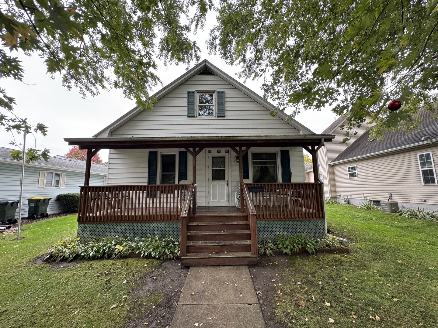 138 North Brown Street Genoa, IL 60135 - Photo 1 of 30 a front view of a house with a garden