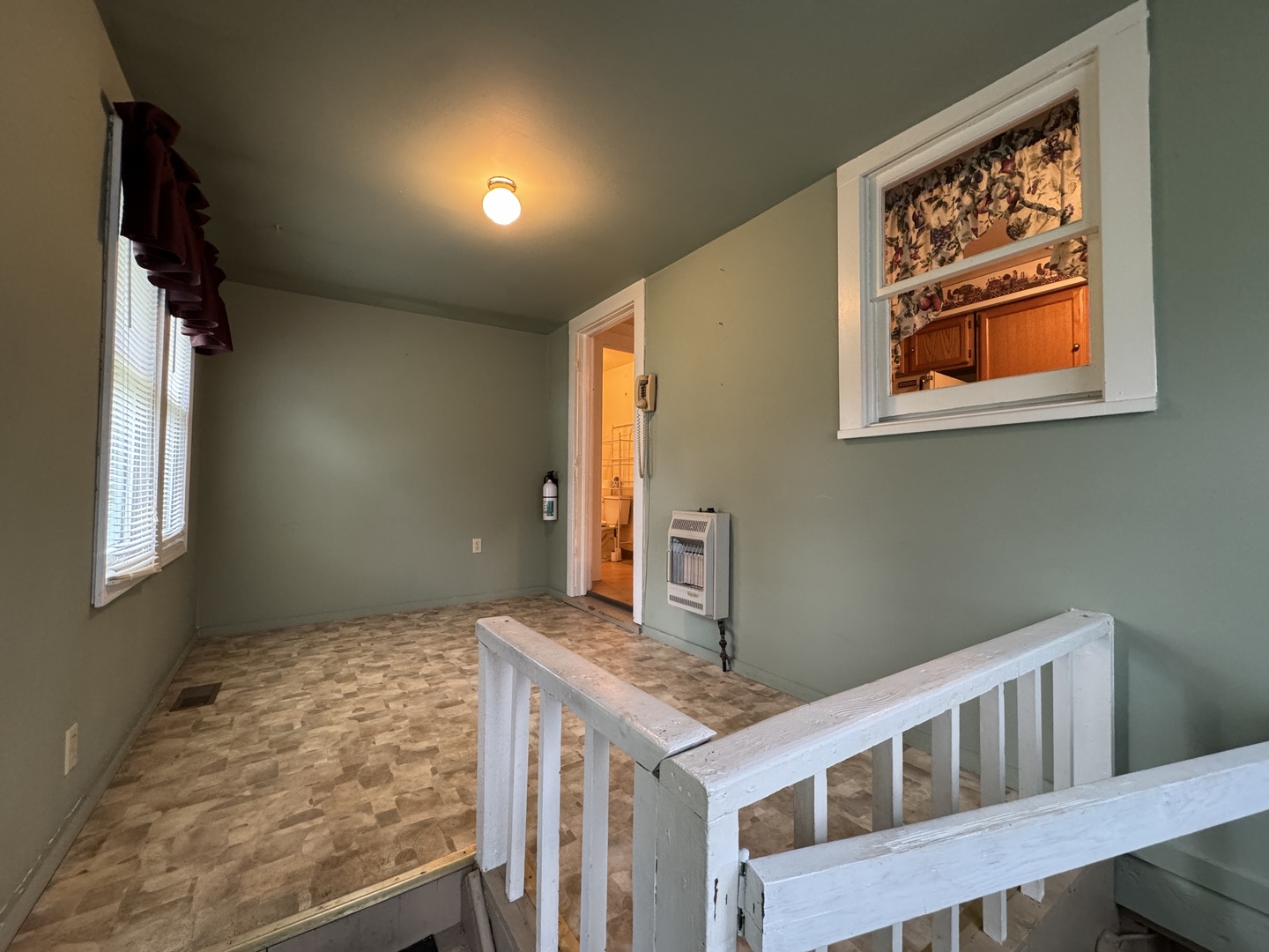 138 North Brown Street Genoa, IL 60135 - Photo 15 of 30 a bedroom with a bed and a window