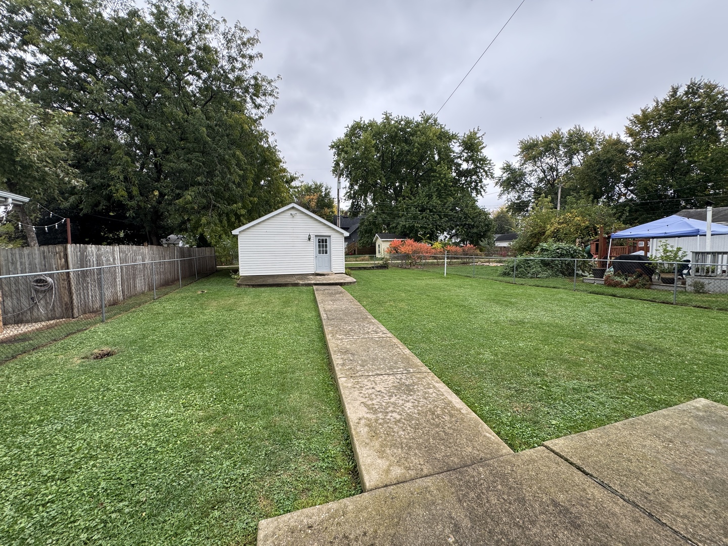 138 North Brown Street Genoa, IL 60135 - Photo 25 of 30 a front view of a house with garden