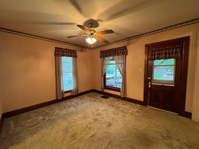 a view of an empty room with a window