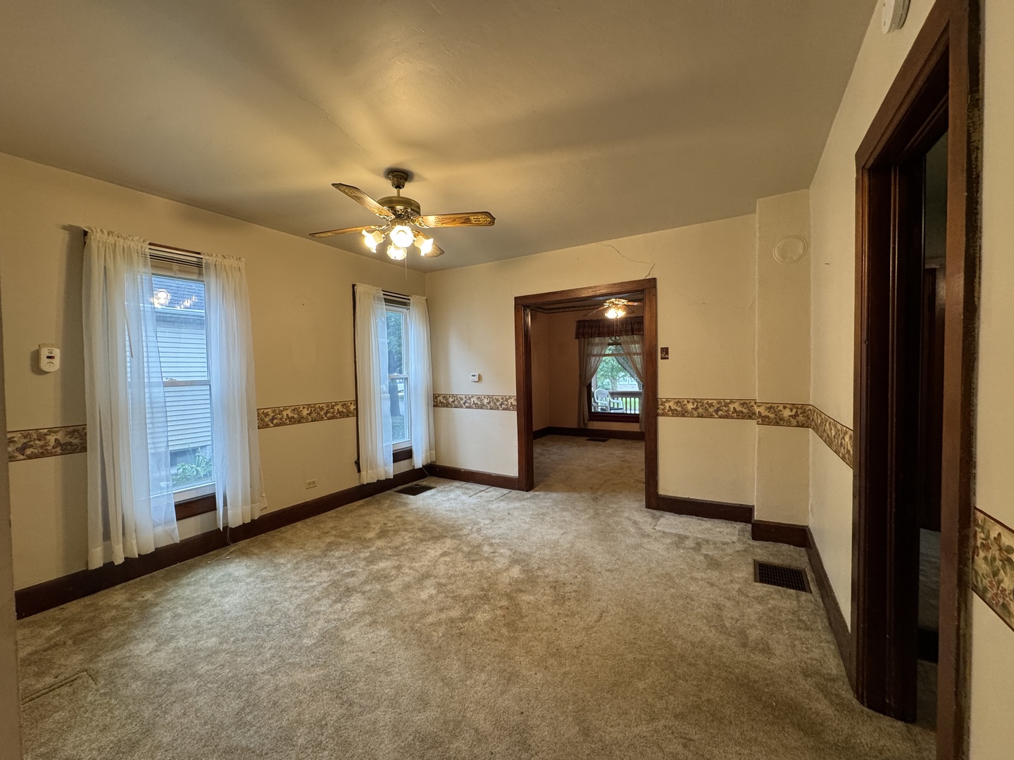 138 North Brown Street Genoa, IL 60135 - Photo 6 of 30 an empty room with closet and a ceiling fan
