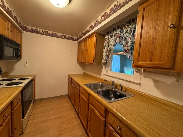 a kitchen with a stove and a microwave