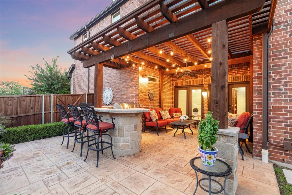 a view of a patio with couches table and chairs and potted plants