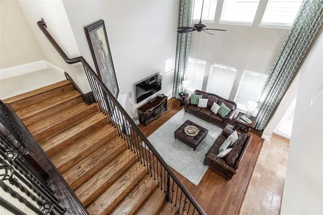 a living room with chairs and a stove
