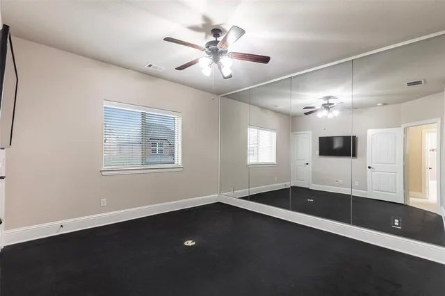 a view of wooden floor and windows in a room