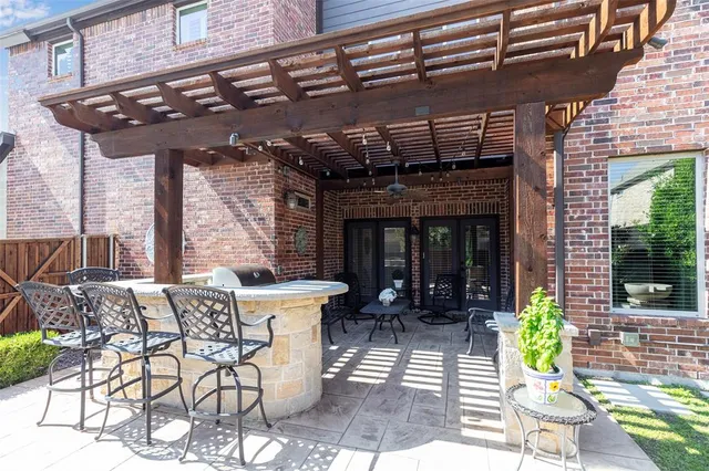 a view of a chairs and table in the patio