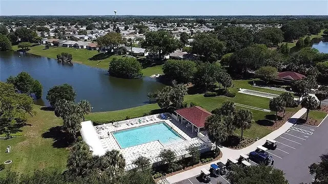 an aerial view of a house with a lake view