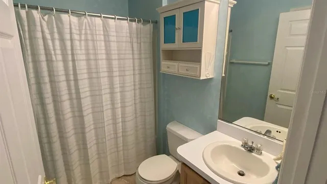 a bathroom with a sink and toilet