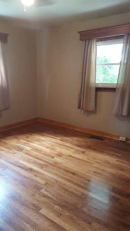 2412 Dugspur Road Callaway, VA 24067 - Photo 15 of 35 a view of an empty room with wooden floor and a window