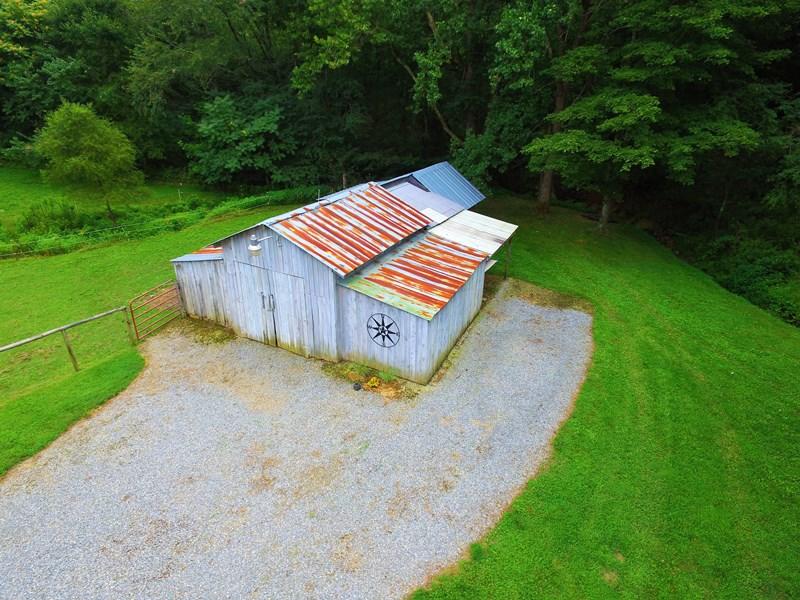 2412 Dugspur Road Callaway, VA 24067 - Photo 3 of 35 a view of a backyard with a garden