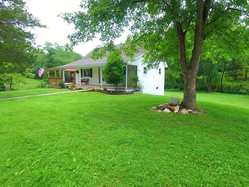 2412 Dugspur Road Callaway, VA 24067 - Photo 30 of 35 a front view of a house with garden