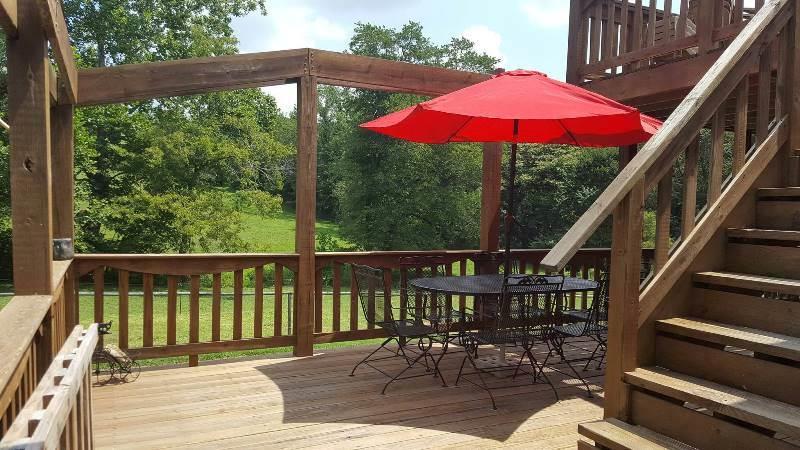 2412 Dugspur Road Callaway, VA 24067 - Photo 33 of 35 a view of balcony with wooden floor and outdoor seating