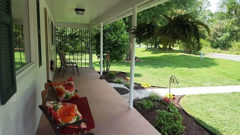 2412 Dugspur Road Callaway, VA 24067 - Photo 6 of 35 a view of a backyard with plants and outdoor seating